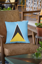 Woman holding a pillow with a geometric design, next to a pillow on a chair.