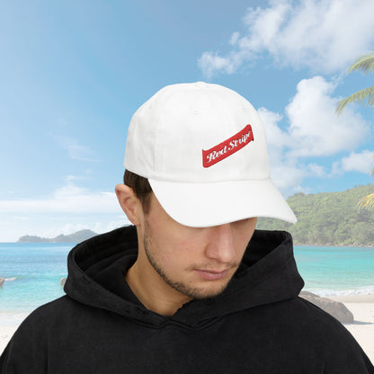 Jamaica Red Stripe Beer Logo Classic Dad Hat. The hat is a casual, curved-brim style with a structured front panel, featuring the Red Stripe Beer logo embroidered prominently in the center. The logo includes the signature red diagonal stripe and text, symbolizing the authentic Jamaican beer brand. The hat comes in a classic yet relaxed vibe, making it an ideal gift for beer enthusiasts, fathers, or anyone celebrating Jamaican heritage.