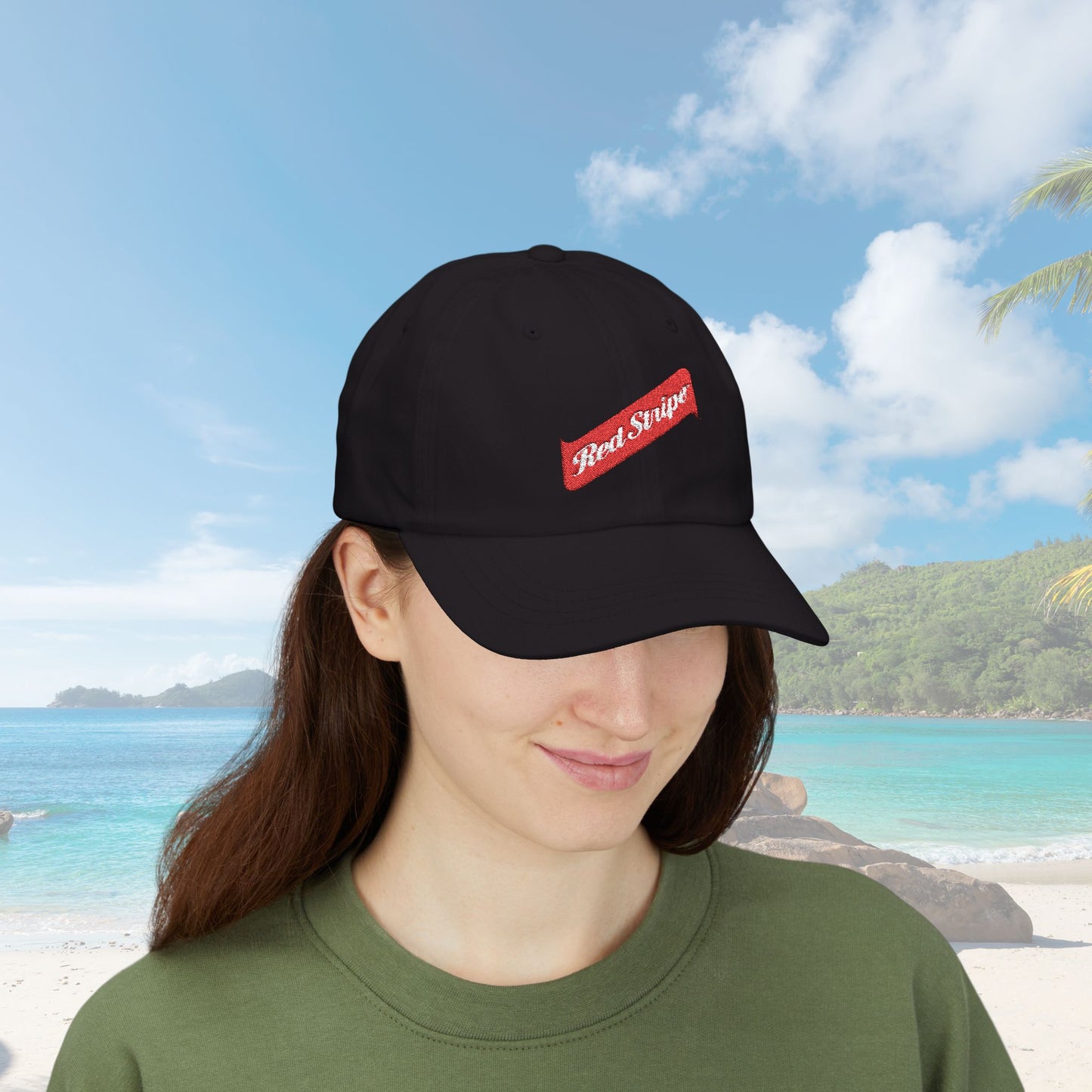Jamaica Red Stripe Beer Logo Classic Dad Hat. The hat is a casual, curved-brim style with a structured front panel, featuring the Red Stripe Beer logo embroidered prominently in the center. The logo includes the signature red diagonal stripe and text, symbolizing the authentic Jamaican beer brand. The hat comes in a classic yet relaxed vibe, making it an ideal gift for beer enthusiasts, fathers, or anyone celebrating Jamaican heritage.