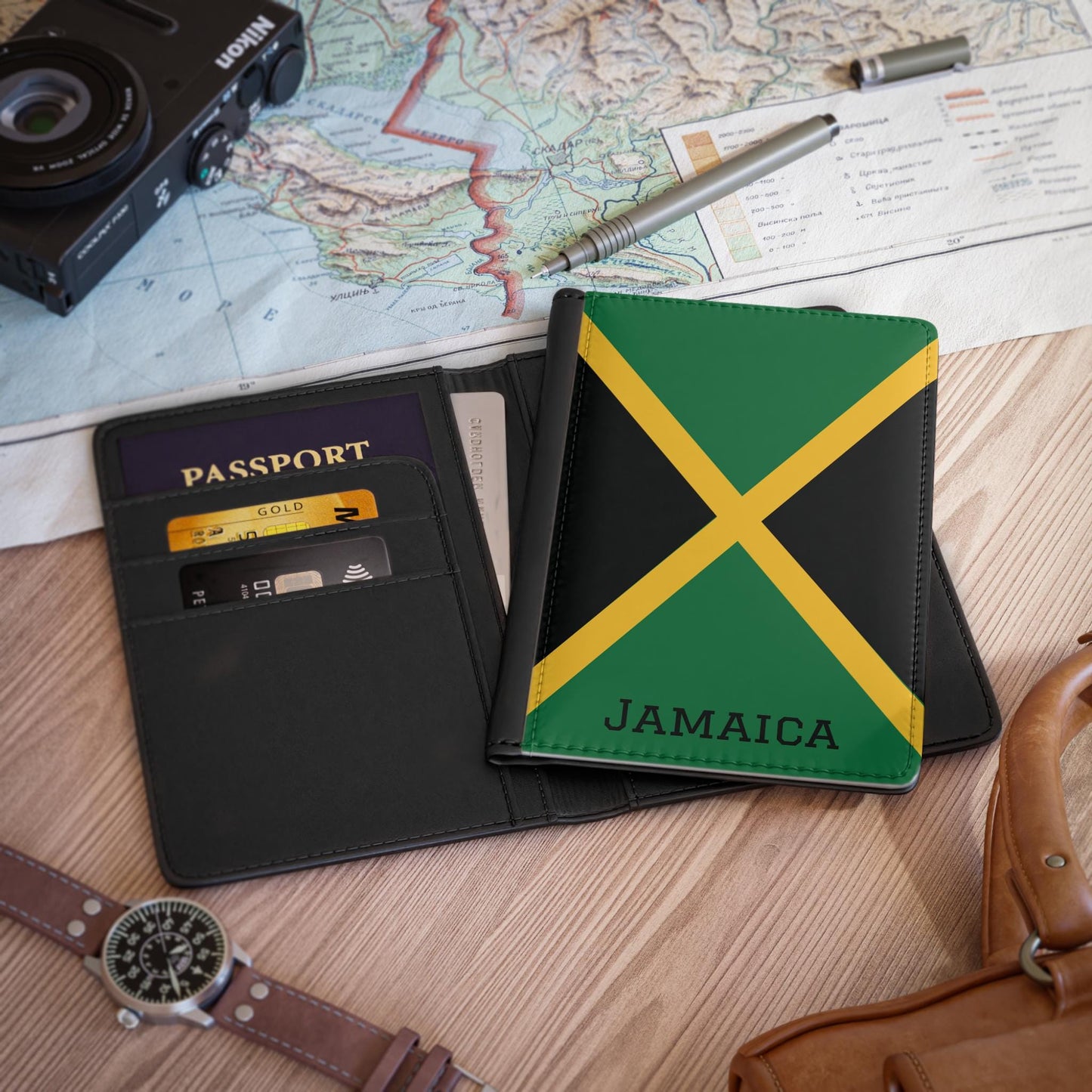 A sleek faux leather passport cover featuring the vibrant flag Jamaica, with the country&#39;s name displayed in a stylish font. This travel accessory offers RFID-blocking protection and compartments for cards and boarding passes.