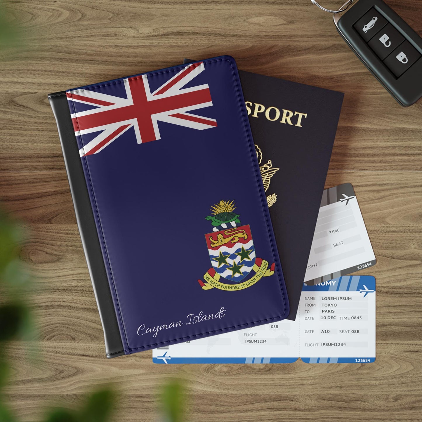 A sleek faux leather passport cover featuring the vibrant flag of the Cayman Islands, with the country&#39;s name displayed in a stylish font. This travel accessory offers RFID-blocking protection and compartments for cards and boarding passes.