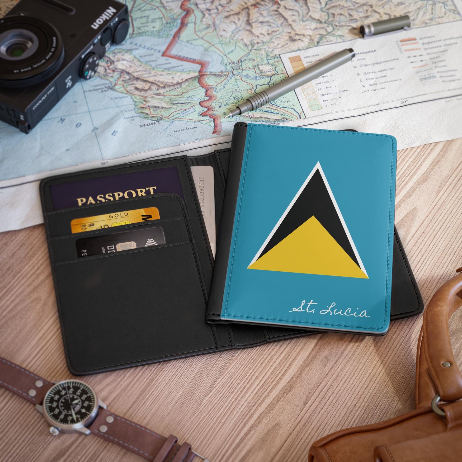 A sleek faux leather passport cover featuring the vibrant flag of Saint Lucia, with the country&#39;s name displayed in a stylish font. This travel accessory offers RFID-blocking protection and compartments for cards and boarding passes.