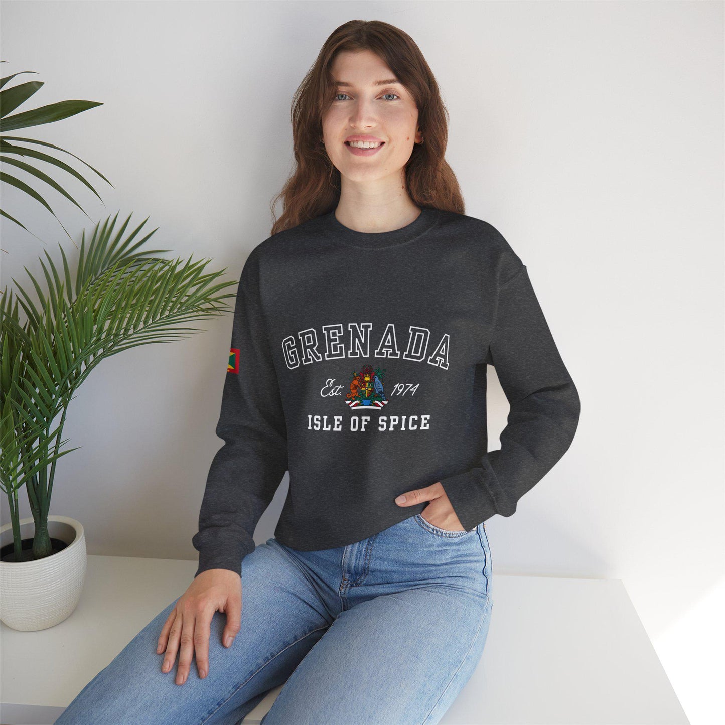 Grenada-inspired varsity sweatshirt featuring the Grenada flag graphic, the island’s independence year, and the Coat of Arms. This stylish sweatshirt showcases bold colors and a design celebrating Grenada’s rich heritage.