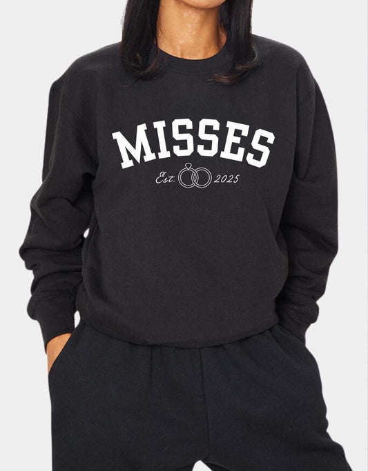 A stylish misses sweatshirt featuring a personalized date design, perfect for Caribbean women. The sweatshirt celebrates newlyweds with a ring design making it an ideal wedding gift, bridal shower present for a Caribbean bride.