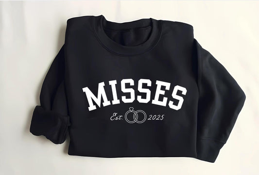 A stylish misses sweatshirt featuring a personalized date design, perfect for Caribbean women. The sweatshirt celebrates newlyweds with a ring design making it an ideal wedding gift, bridal shower present for a Caribbean bride.