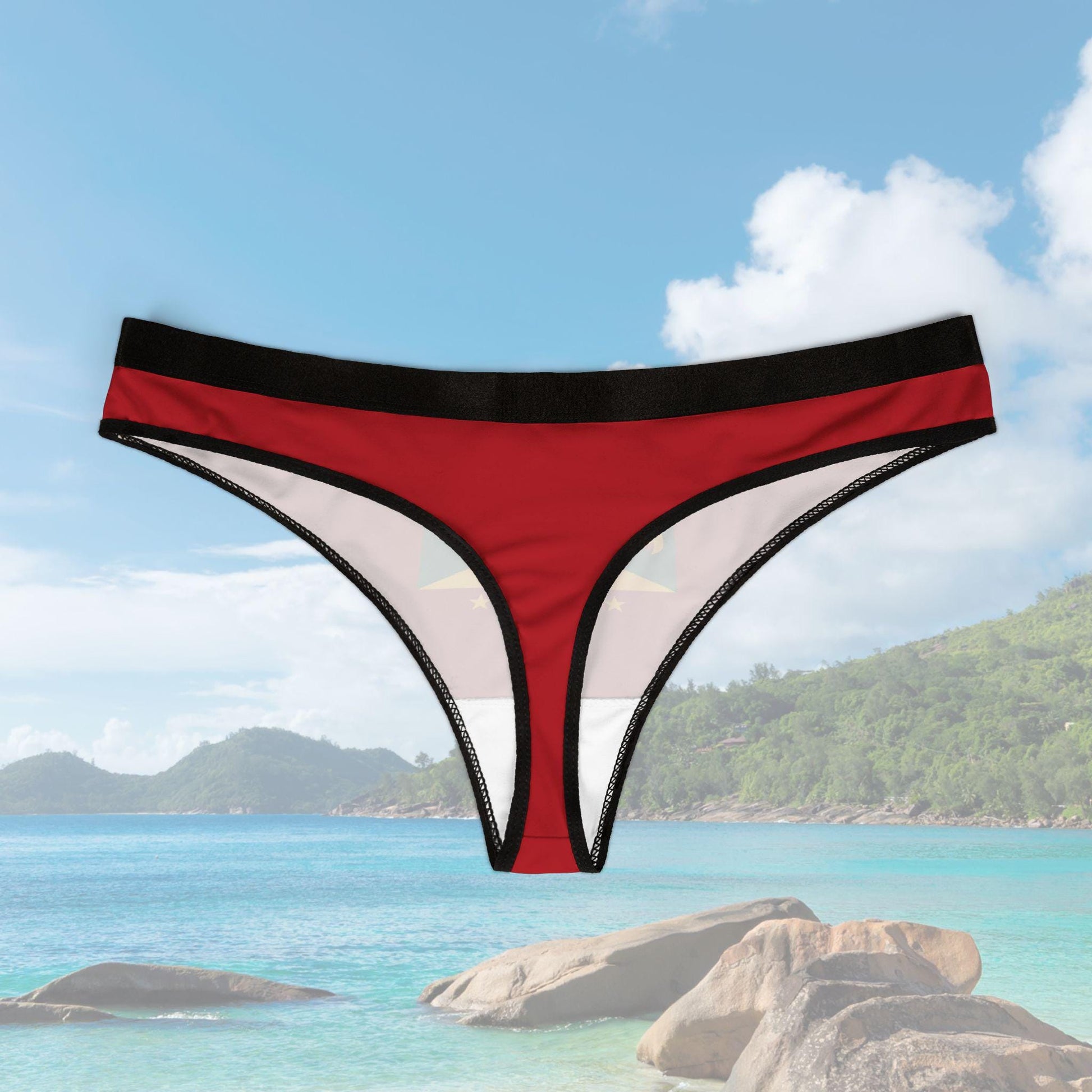 A Grenada Bikini Thong featuring the bold colors of the Grenada flag. This tropical island-inspired women&#39;s thong is perfect for showcasing Caribbean pride. Designed with a sleek and comfortable fit, it’s ideal for Spicemas 2025.