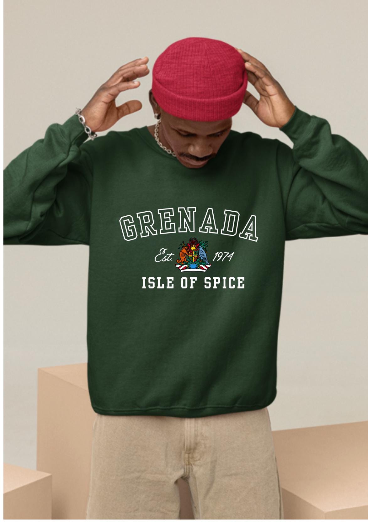 Grenada-inspired varsity sweatshirt featuring the Grenada flag graphic, the island’s independence year, and the Coat of Arms. This stylish sweatshirt showcases bold colors and a design celebrating Grenada’s rich heritage.