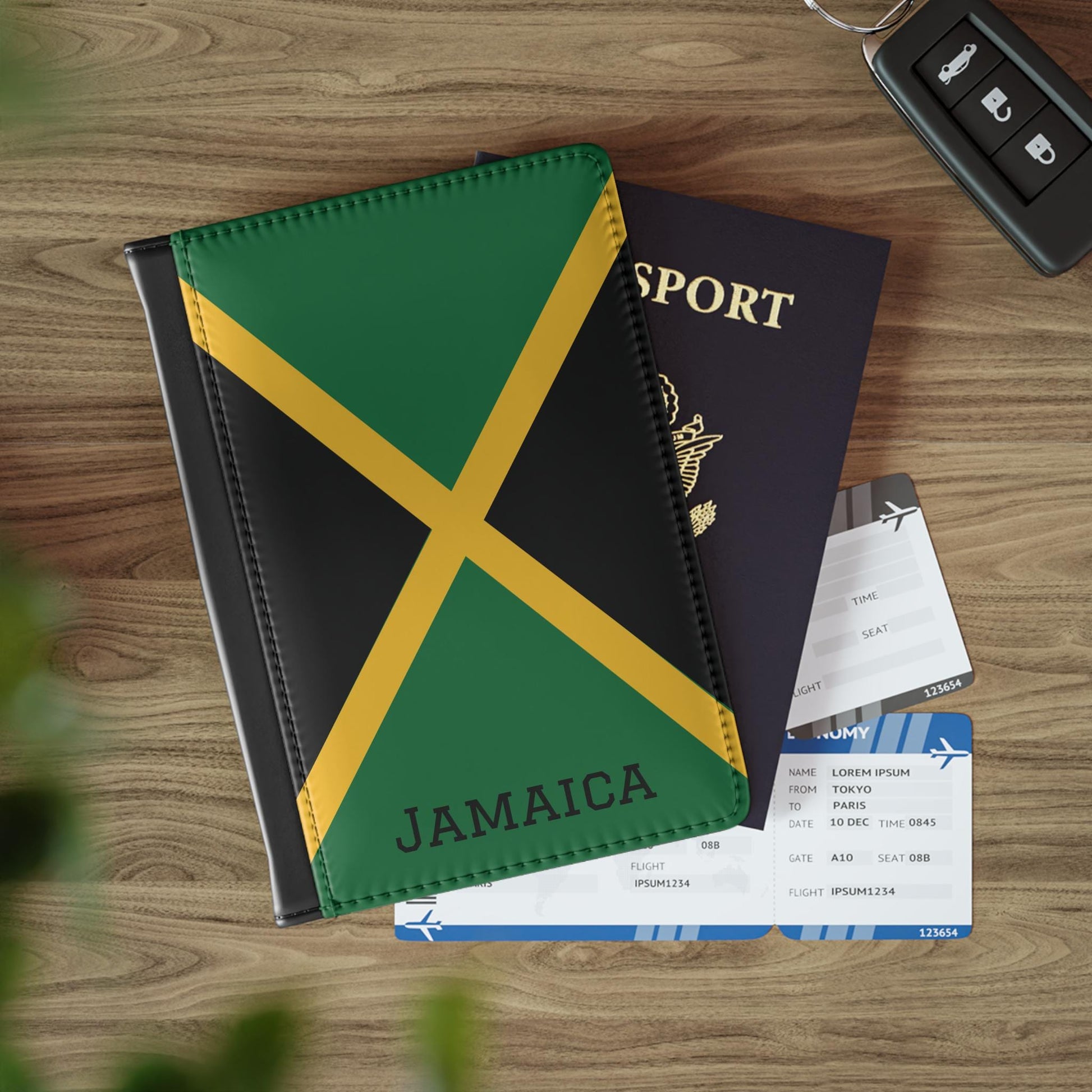 A sleek faux leather passport cover featuring the vibrant flag Jamaica, with the country&#39;s name displayed in a stylish font. This travel accessory offers RFID-blocking protection and compartments for cards and boarding passes.