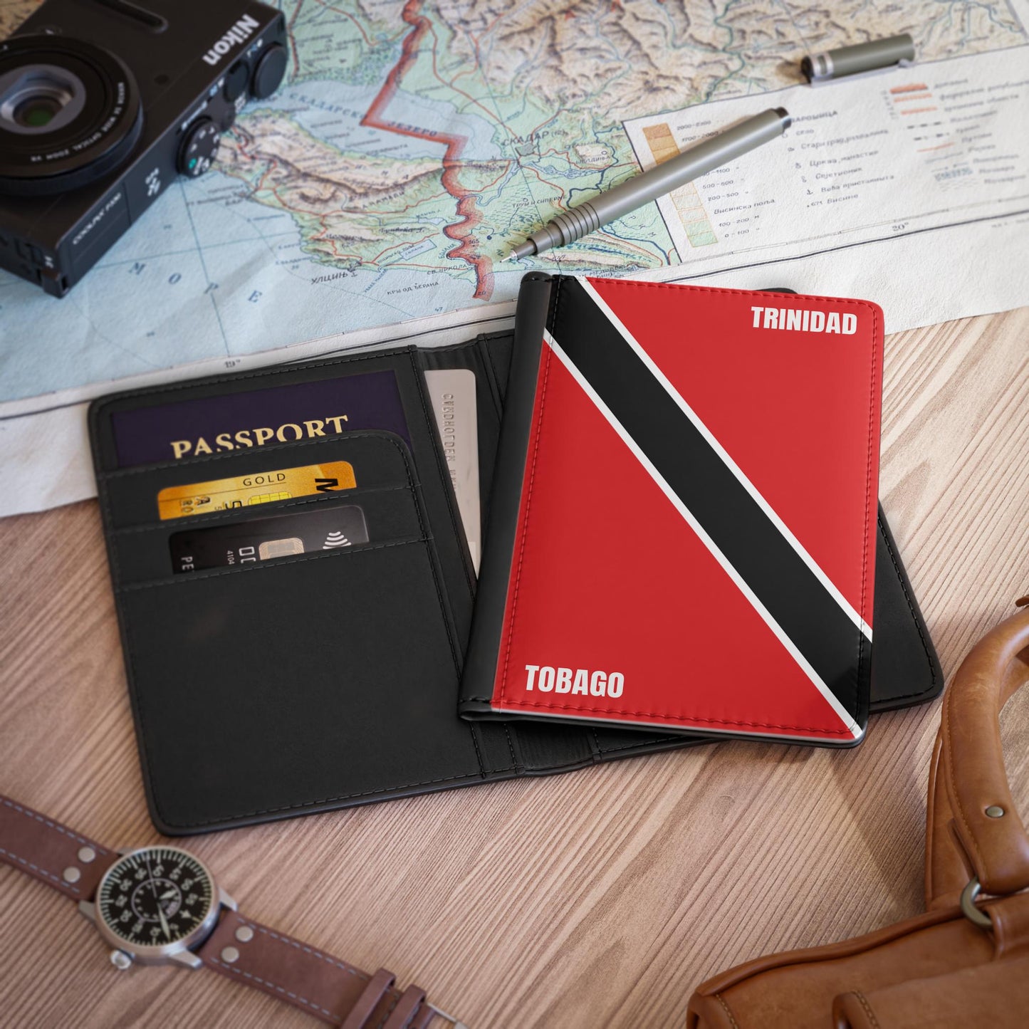 A sleek faux leather passport cover featuring the vibrant flag Trinidad & Tobago, with the country&#39;s name displayed in a stylish font. This travel accessory offers RFID-blocking protection and compartments for cards and boarding passes.