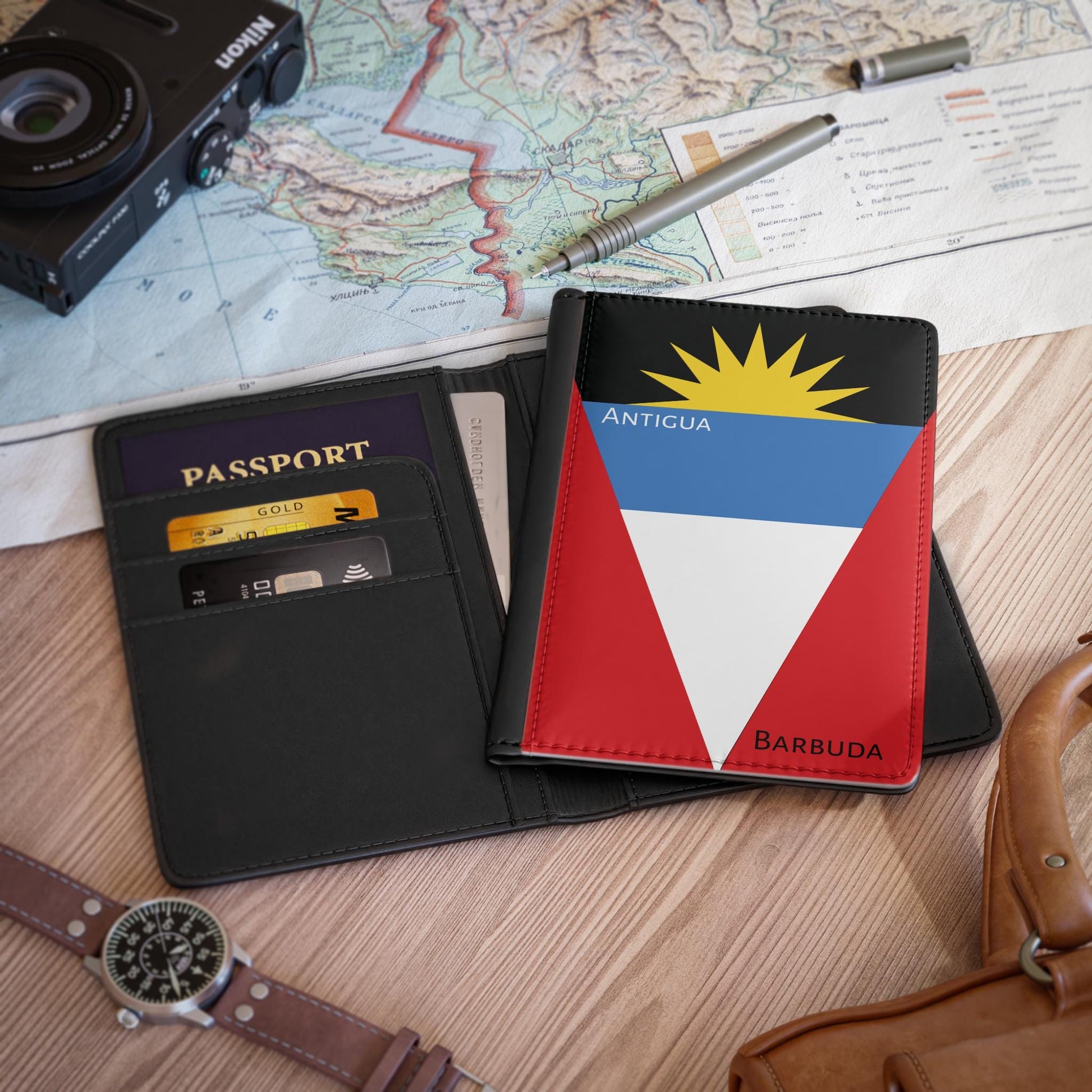 A sleek faux leather passport cover featuring the vibrant flag of Antigua & Barbuda, with the country&#39;s name displayed in a stylish font. This travel accessory offers RFID-blocking protection and compartments for cards and boarding passes.