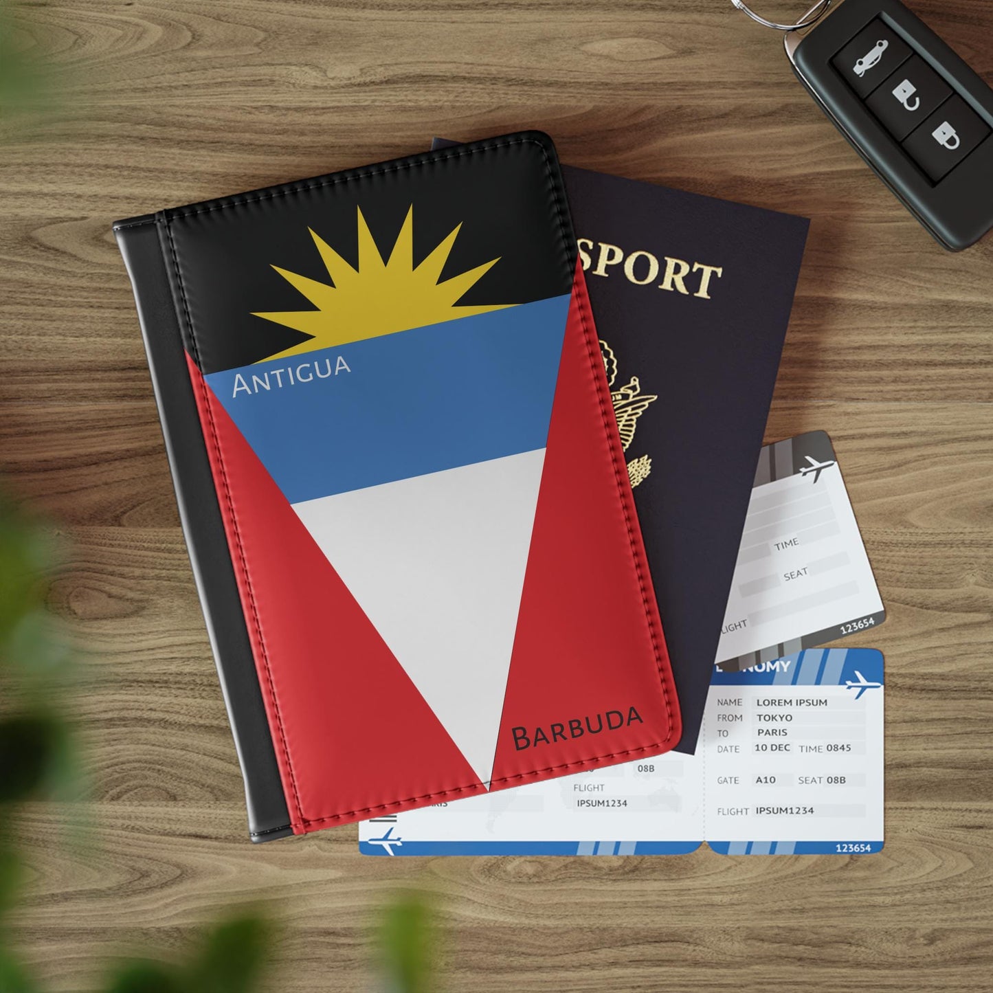 A sleek faux leather passport cover featuring the vibrant flag of Antigua & Barbuda, with the country&#39;s name displayed in a stylish font. This travel accessory offers RFID-blocking protection and compartments for cards and boarding passes.