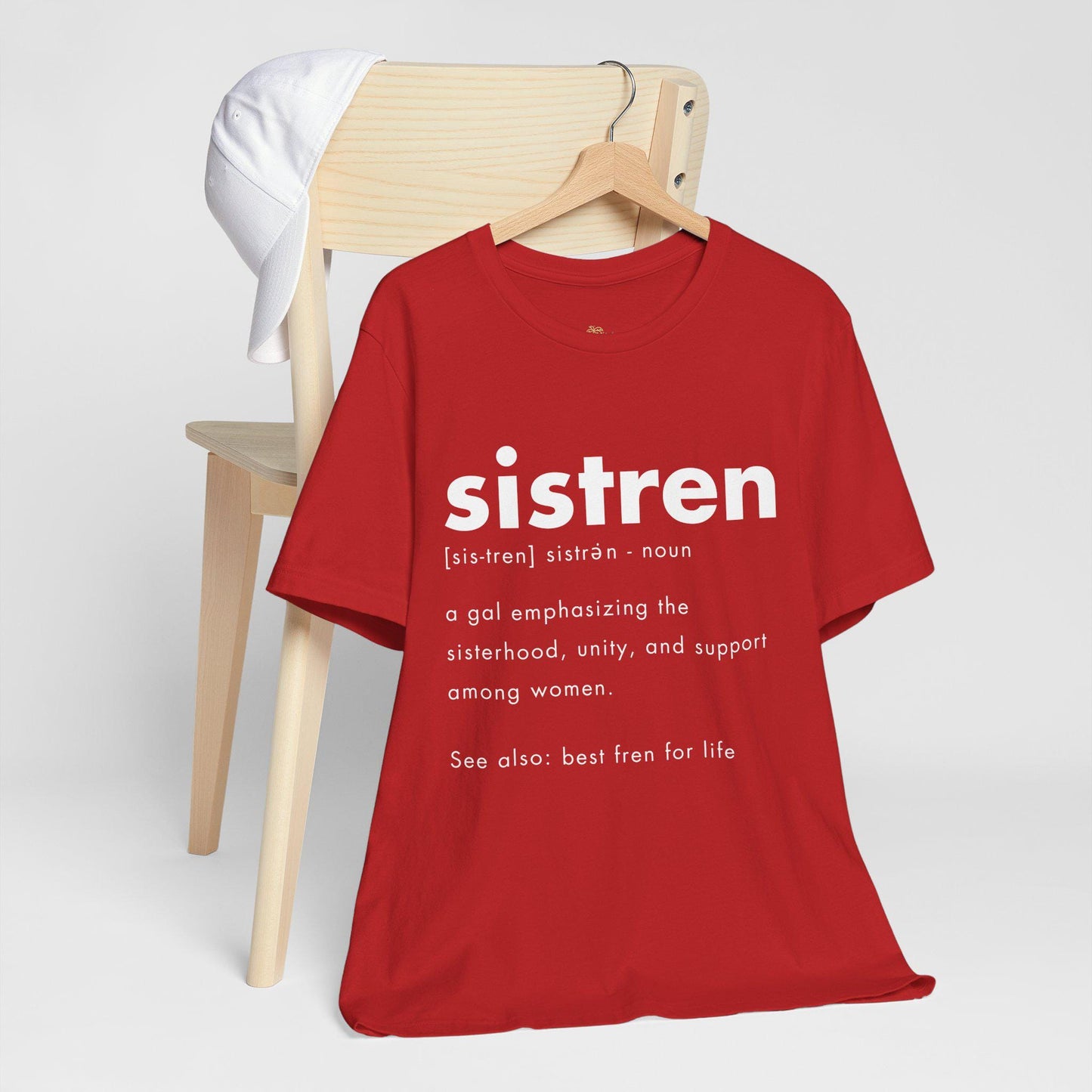 T-shirt with the word &quot;sistren&quot; in bold. Definition text describes it as emphasizing sisterhood, unity, and support among women. Tone: supportive. Caribbean sister term