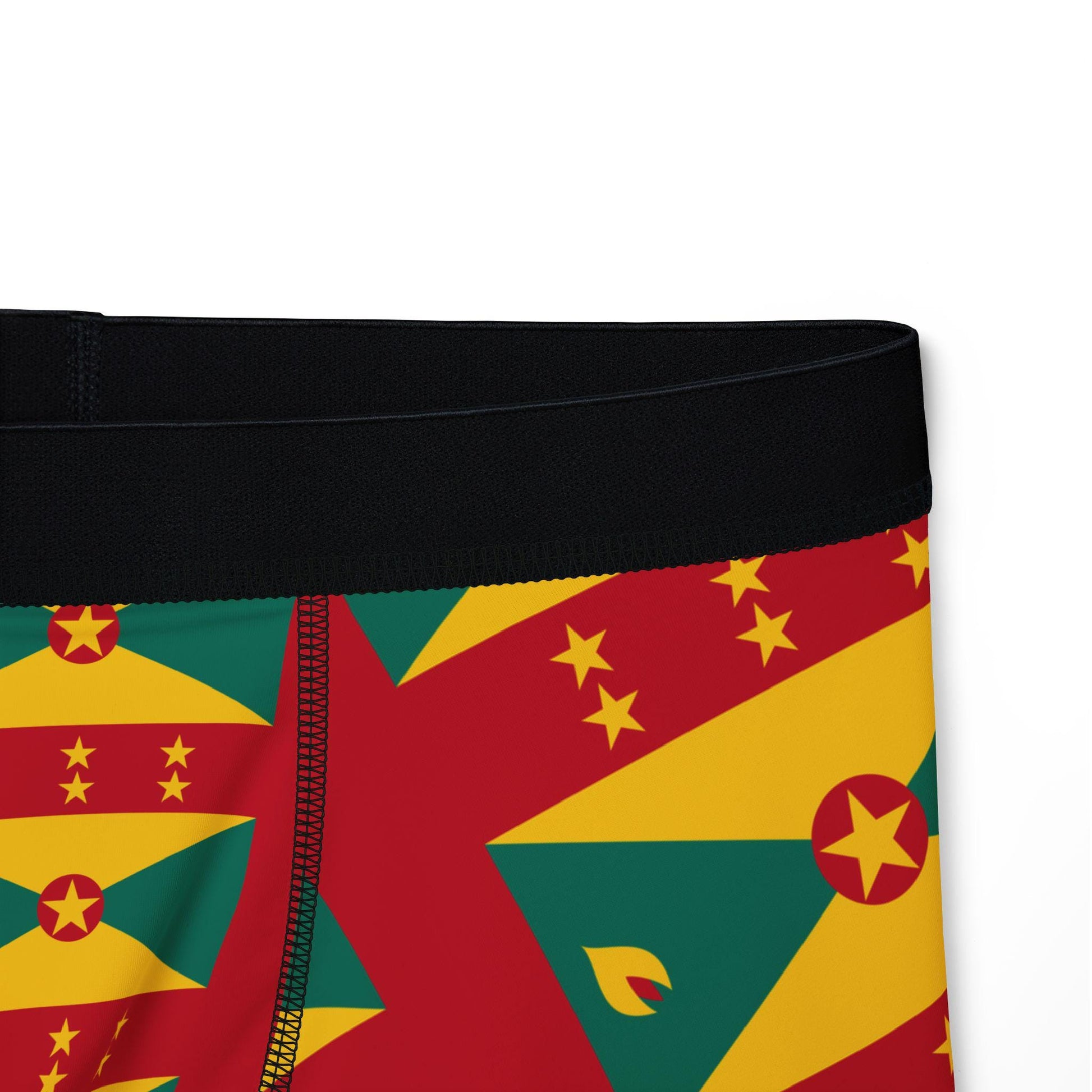 Boxer briefs featuring the Grenada flag pattern in vibrant red, yellow, and green with black waistband. The tone is bold and patriotic.