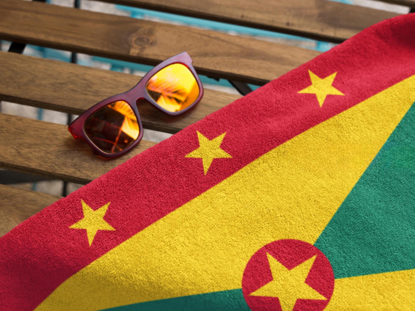 Grenada Flag Towel: Flag with a red background and a yellow, green pattern. A central red circle with a yellow star, surrounded by six yellow stars. Vibrant and bold Grenadian Rag for carnivals, fetes, and parties.