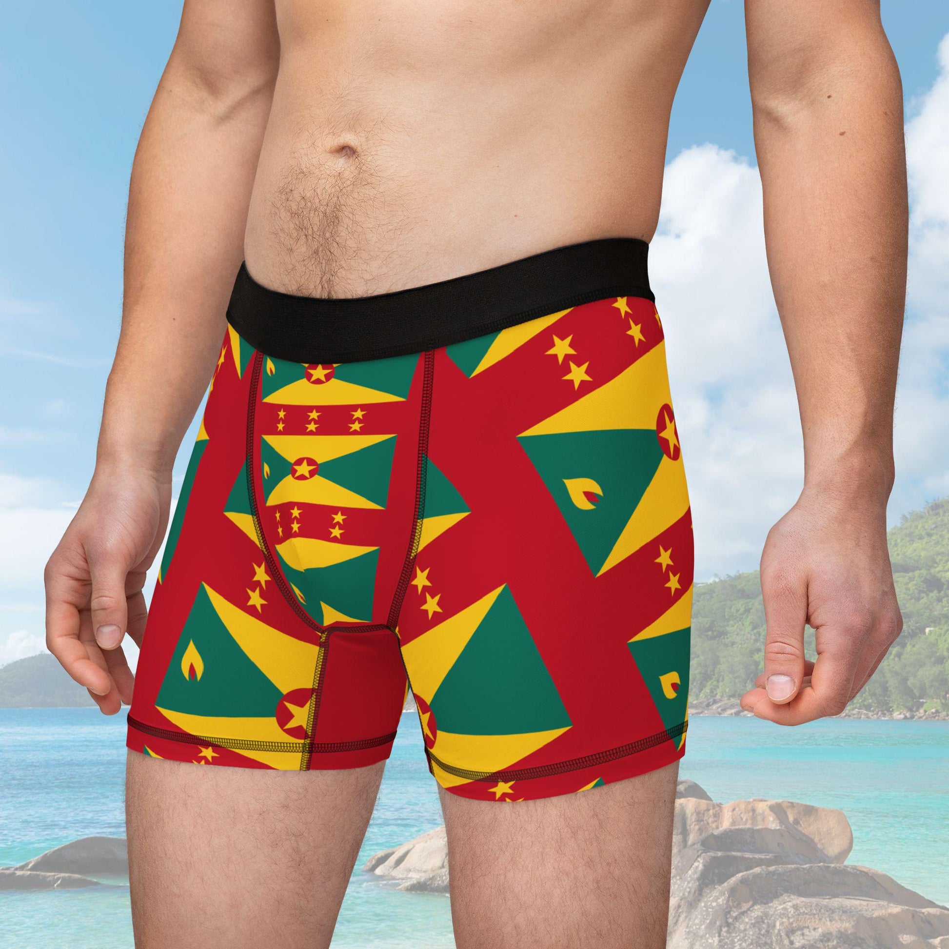 Boxer briefs featuring the Grenada flag pattern in vibrant red, yellow, and green with black waistband. The tone is bold and patriotic.