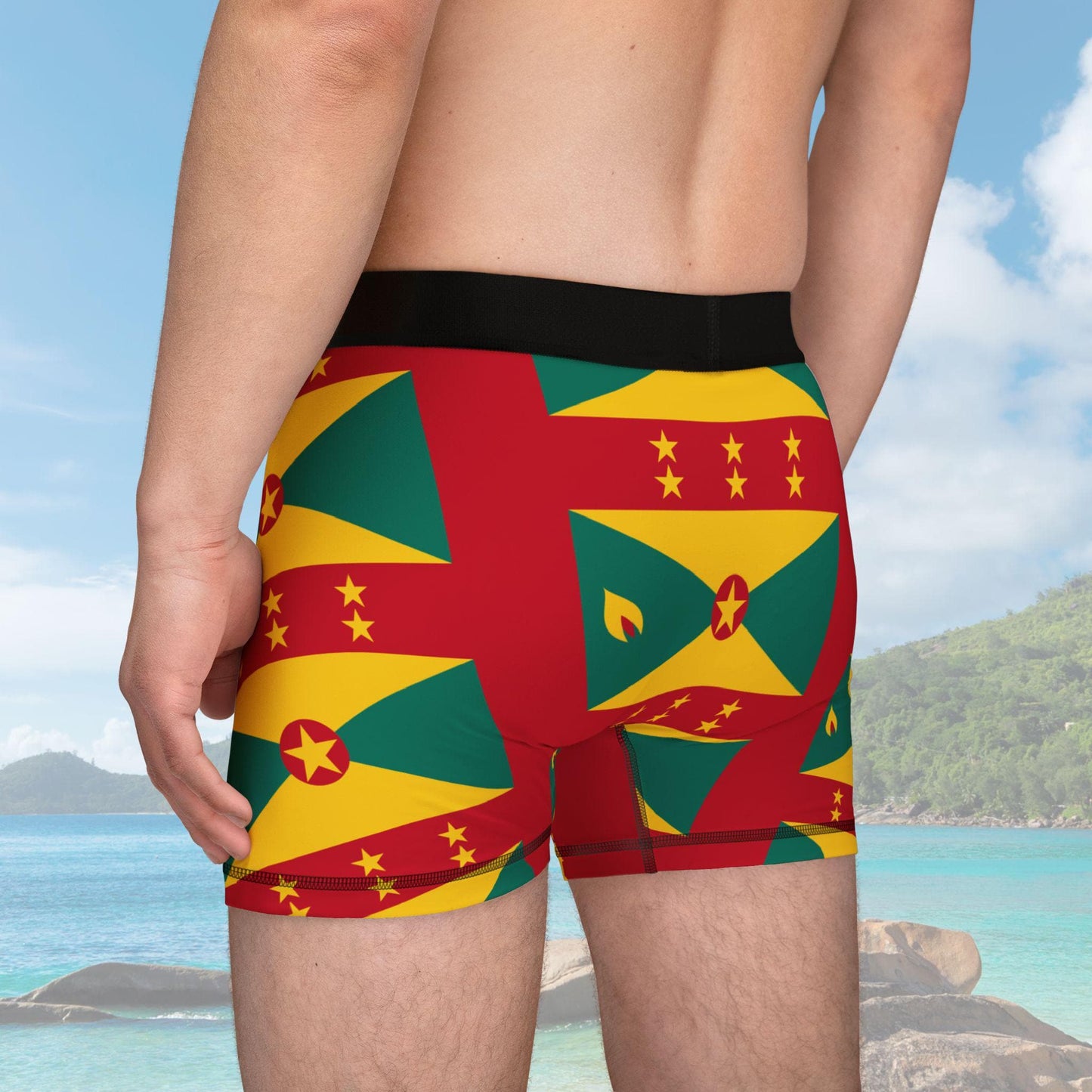 Boxer briefs featuring the Grenada flag pattern in vibrant red, yellow, and green with black waistband. The tone is bold and patriotic.